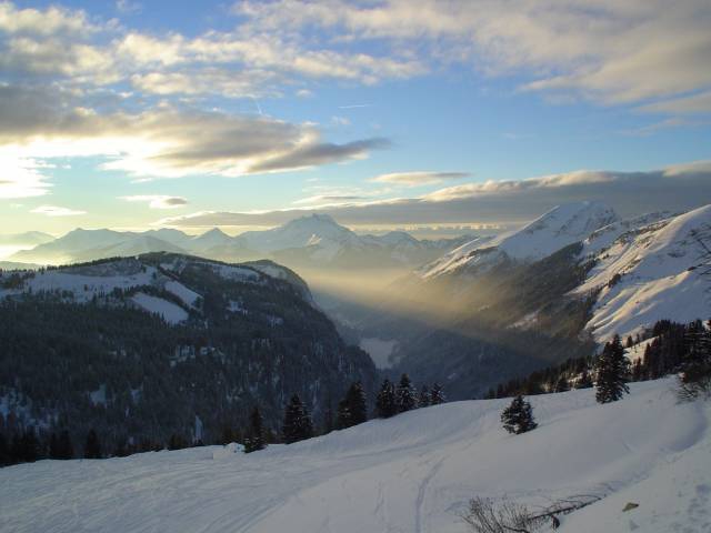 Shafts of sunlight from the setting Sun, The French Alps