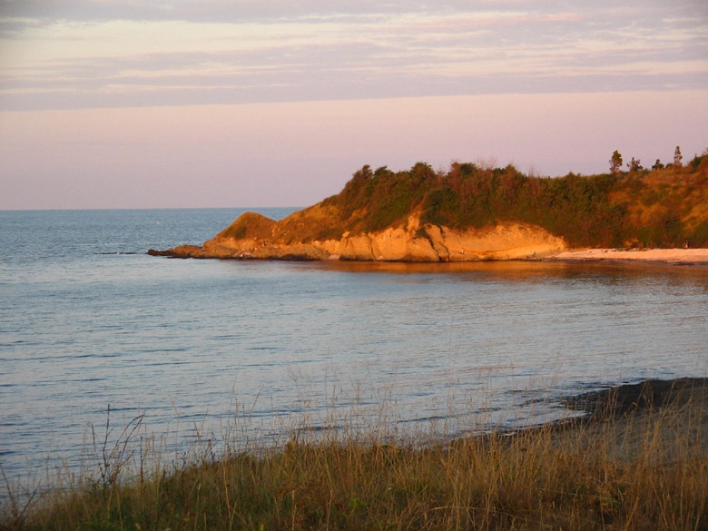 към края