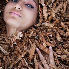 Brown girl in the leaves