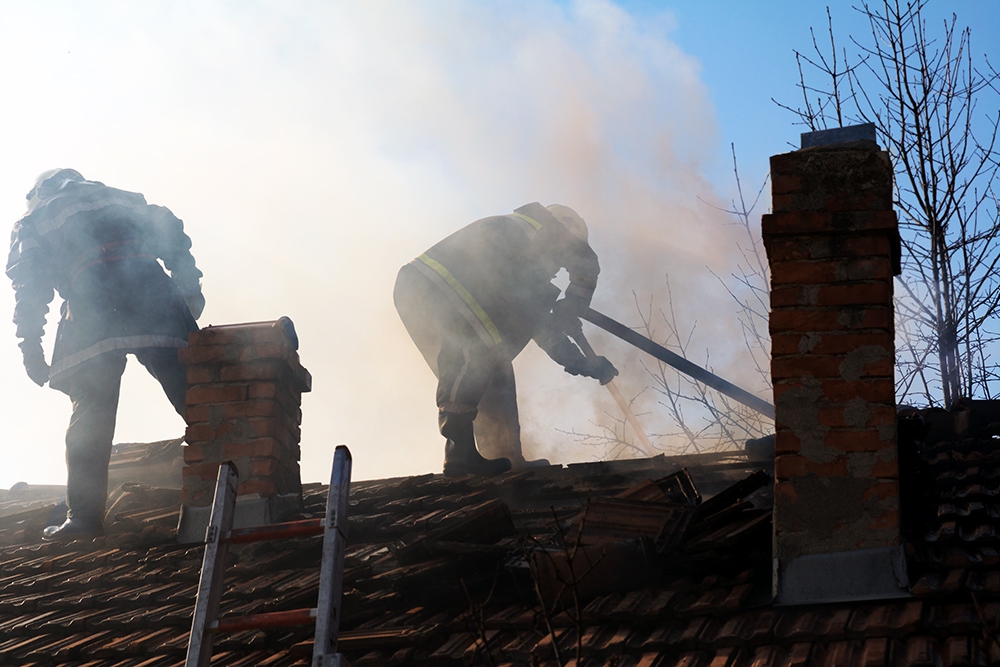 firefighters on the roof
