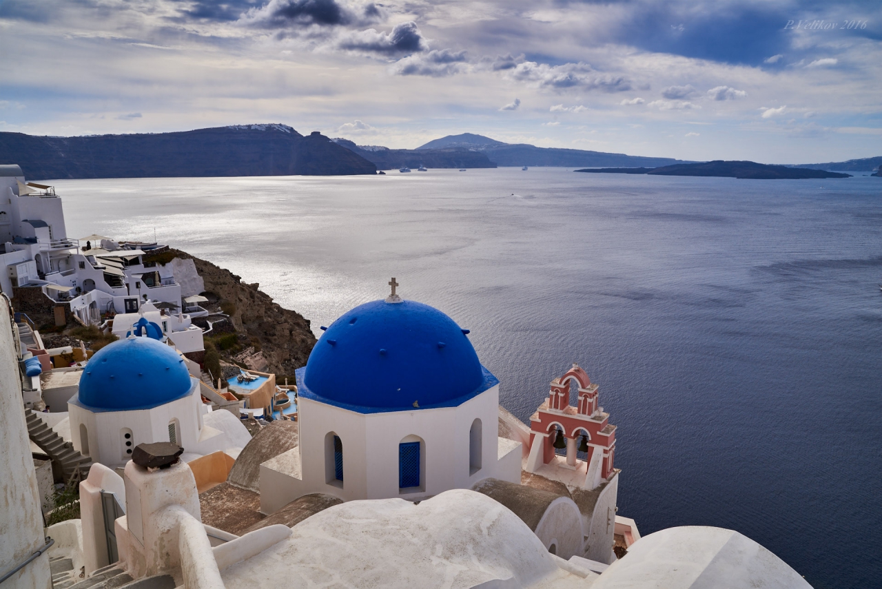 Santorini's famous blue domed tree bells church