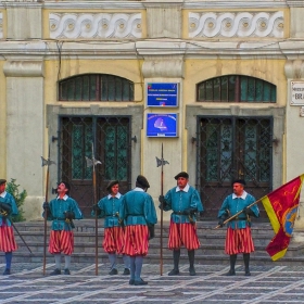 Traditionally dressed men in front of the Brasov Historical Museum